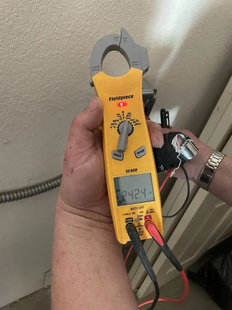 Voltage testing with clamp meter during Ceiling Fan Installation in Jackson